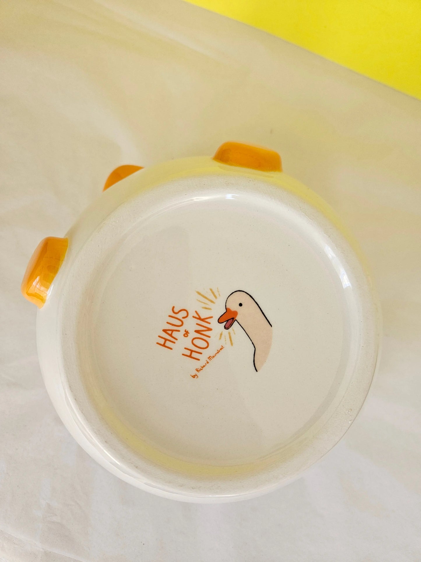Base of a bowl with a decal showing the name Haus of Honk