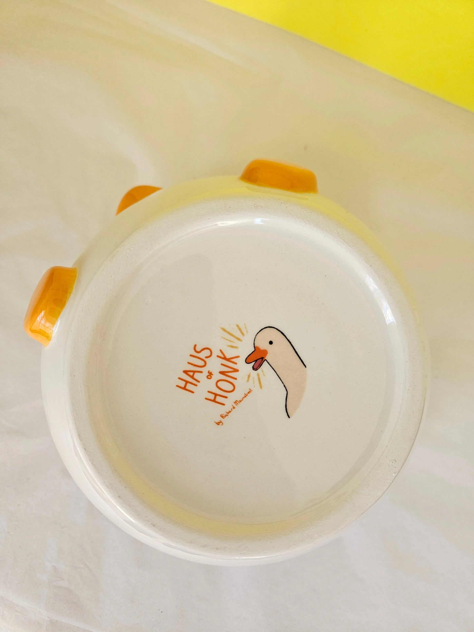 Base of a bowl with a decal showing the name Haus of Honk