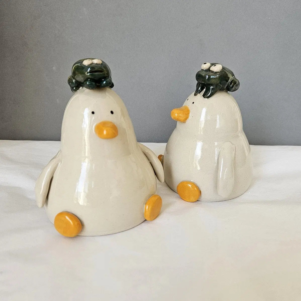 Rhydian with the Amphibian - Frog Duck - Richard Moonstreet Ceramics Handmade ornament with frog sat on head